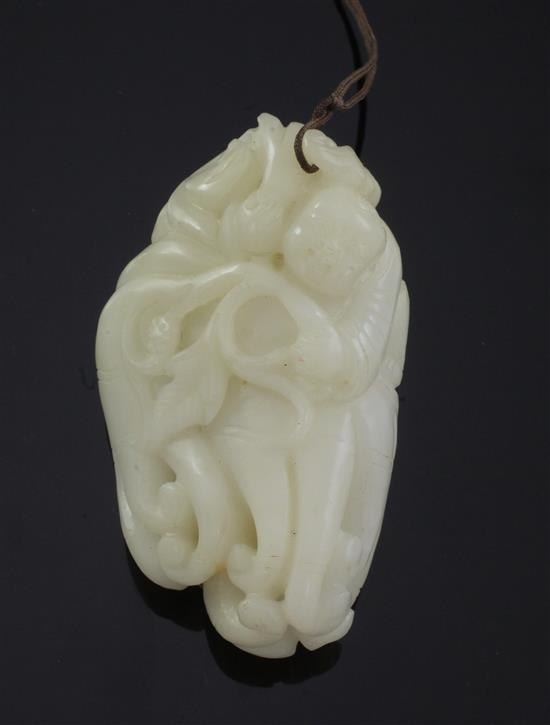 A Chinese white jade carving of a boy clambering on a finger citron, 7.7cm